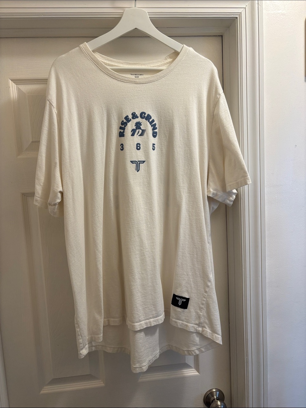 Rise & Grind 365 Short Sleeve Tee - Cream with Blue Logo
